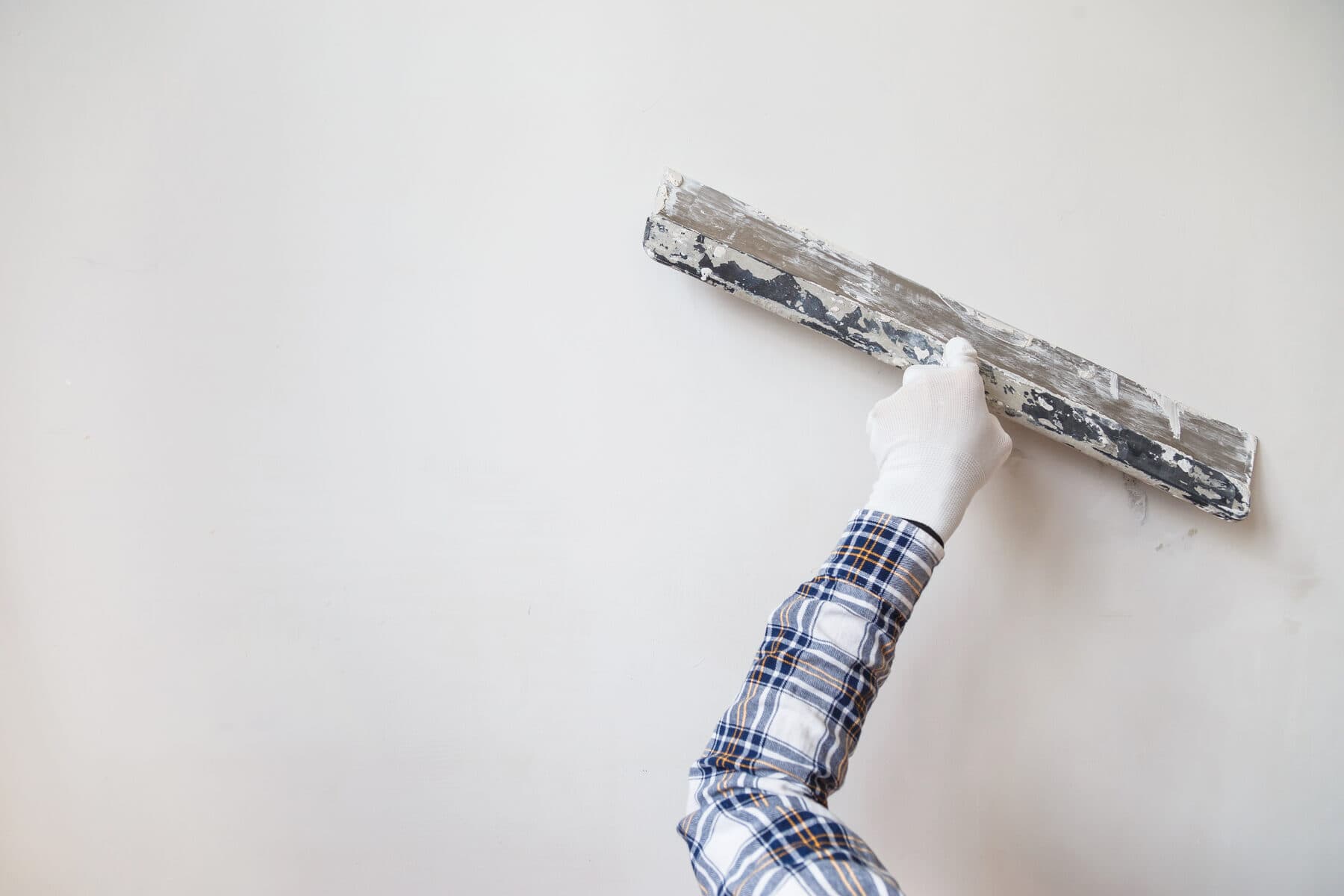 Graceful Interiors crew handling drywall board on site