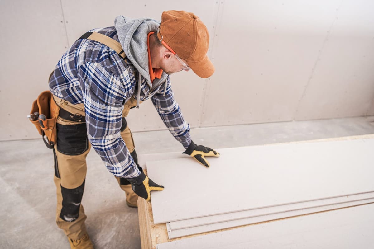 Stack of gypsum board staged and ready for installation